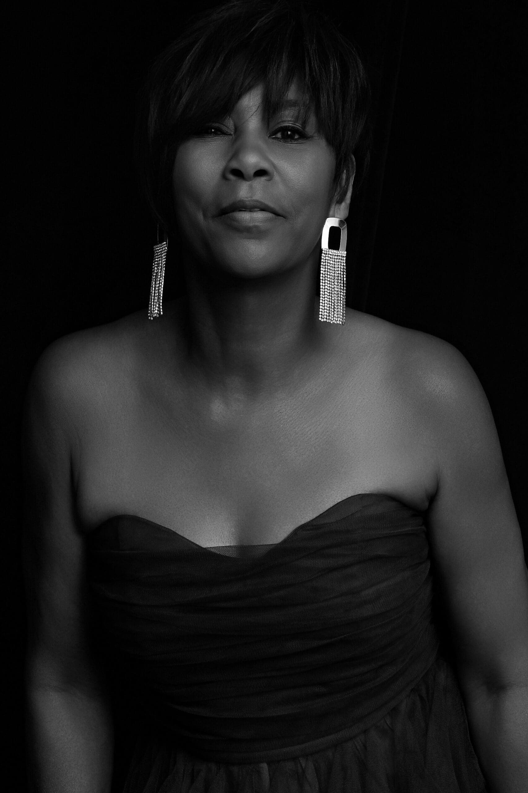 66-year-old woman celebrating her birthday with a luxury portrait session at Turron House Studio in Atlanta.