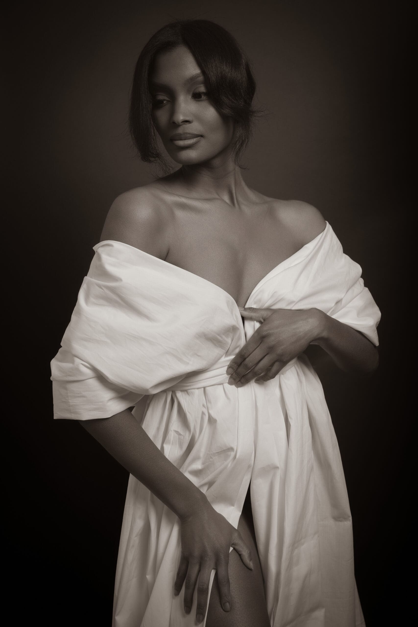 woman relaxing in silk robe before luxury portrait session Atlanta