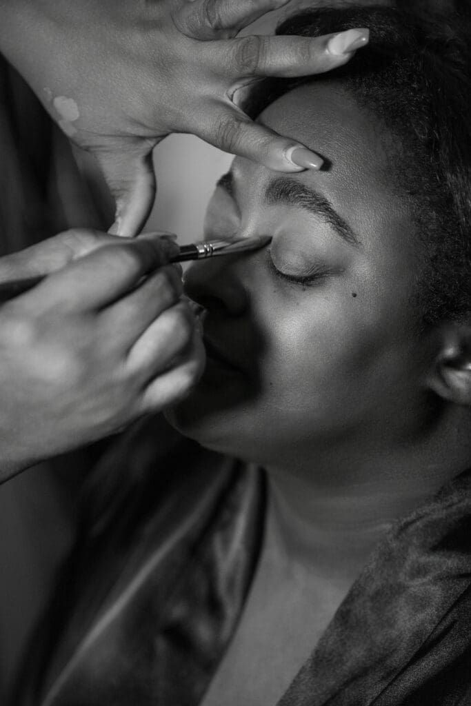 makeup artist preparing client at turron house studio in atlanta