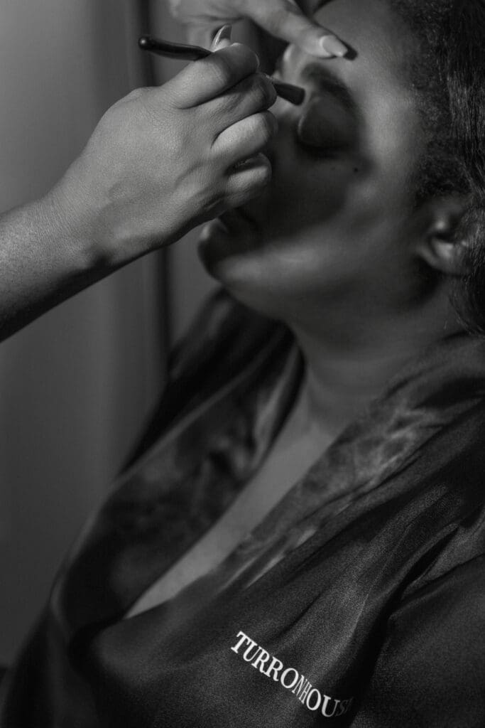 woman in silk robe during portrait session at atlanta luxury portrait studio